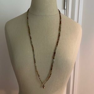 Long necklace with small charm